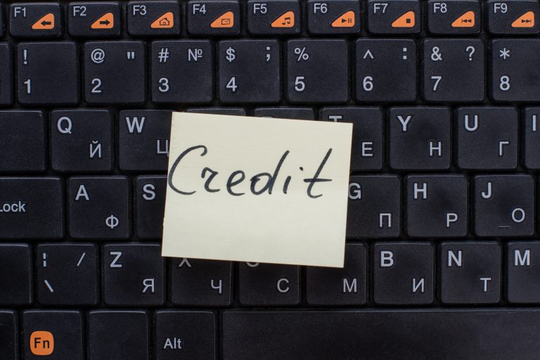 Credit words written on note paper.