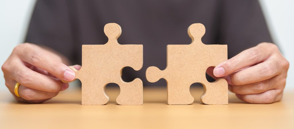 Hand connecting couple puzzle piece. Understanding the puzzle of soft and hard inquiries.