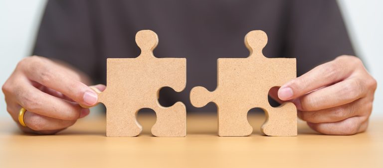 Hand connecting couple puzzle piece. Understanding the puzzle of soft and hard inquiries.
