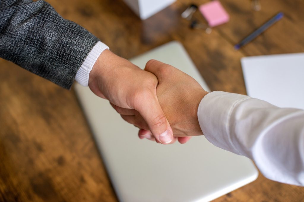 Partnership agreement. shake hands in the office, make a deal