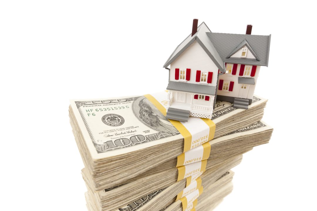 Small House on Stacks of Hundred Dollar Bills
