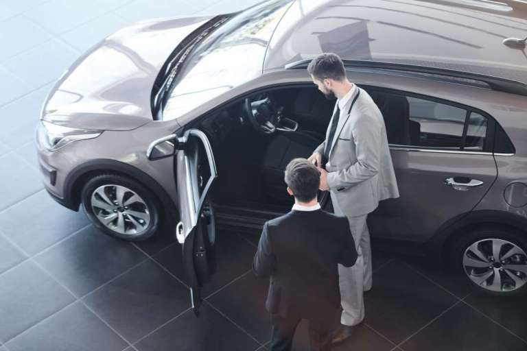 Man buying a new car