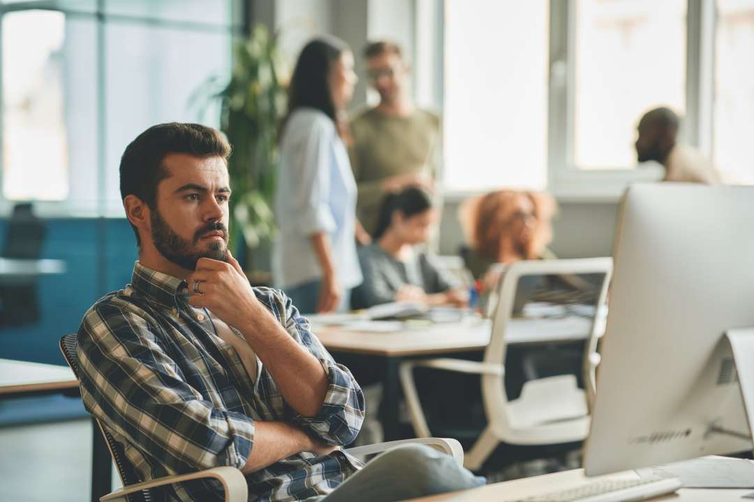 Bearded gentleman considering his options provided by a line of credit.
